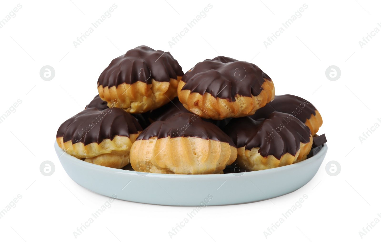 Photo of Delicious profiteroles with chocolate spread isolated on white