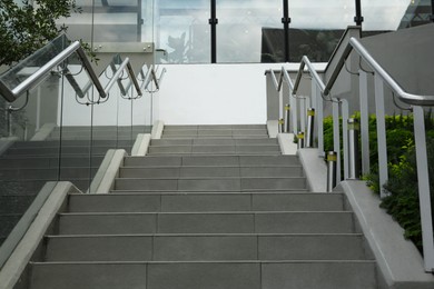 Photo of Outdoor staircase with metal handrails on city street
