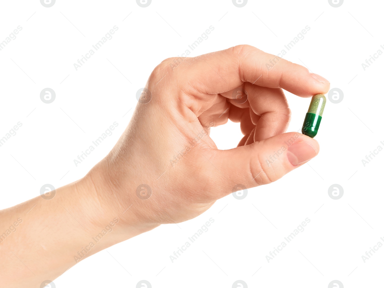 Photo of Woman holding spirulina pill on white background, closeup