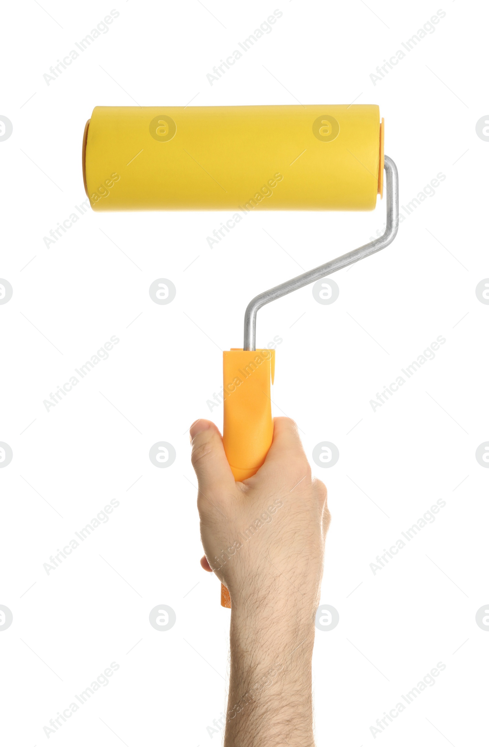 Photo of Man holding paint roller brush on white background, closeup