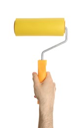 Photo of Man holding paint roller brush on white background, closeup