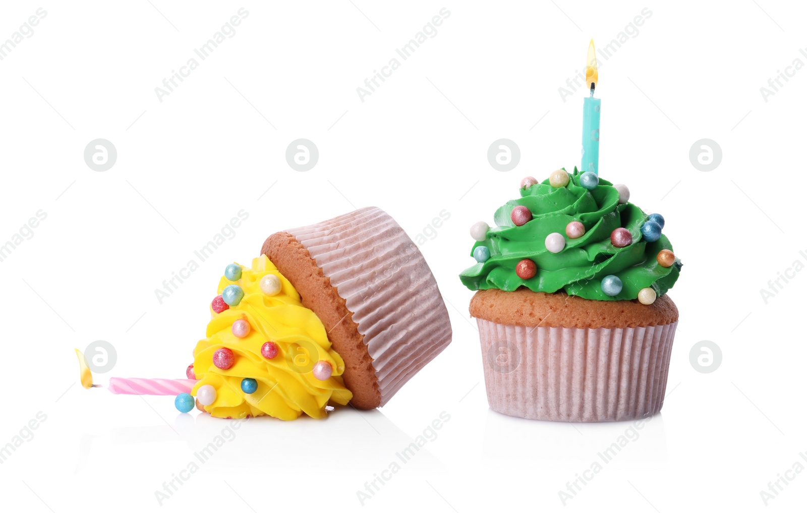 Photo of Dropped and good cupcakes on white background. Troubles happen