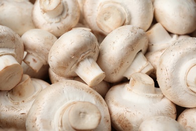 Photo of Fresh champignon mushrooms as background. Healthy food