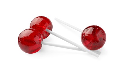 Photo of Many sweet red lollipops isolated on white