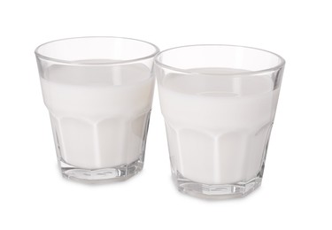 Photo of Glasses of fresh milk isolated on white