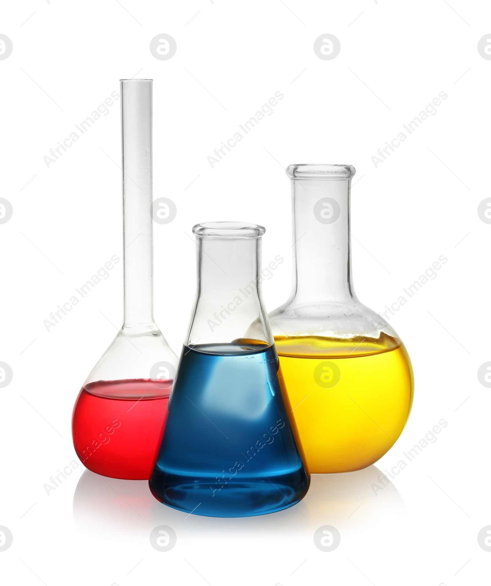 Photo of Laboratory glassware with colorful liquids on white background