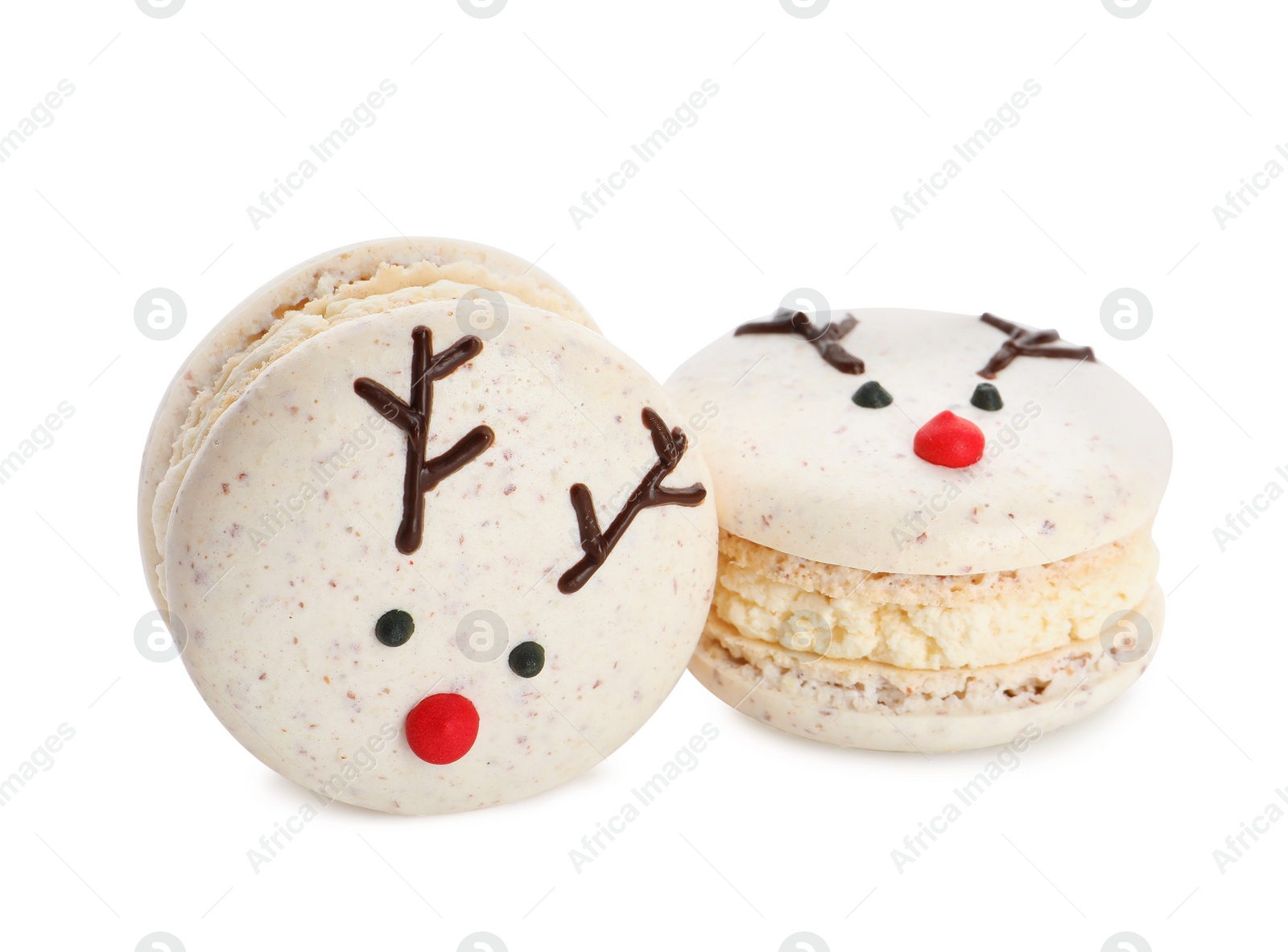 Photo of Delicious Christmas reindeer macarons on white background