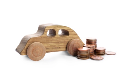 Car model and coins on white background. Money saving concept