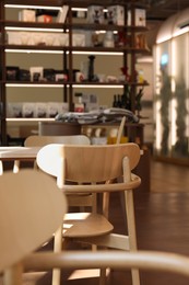 Photo of Modern cafe with stylish furniture, selective focus. Interior design