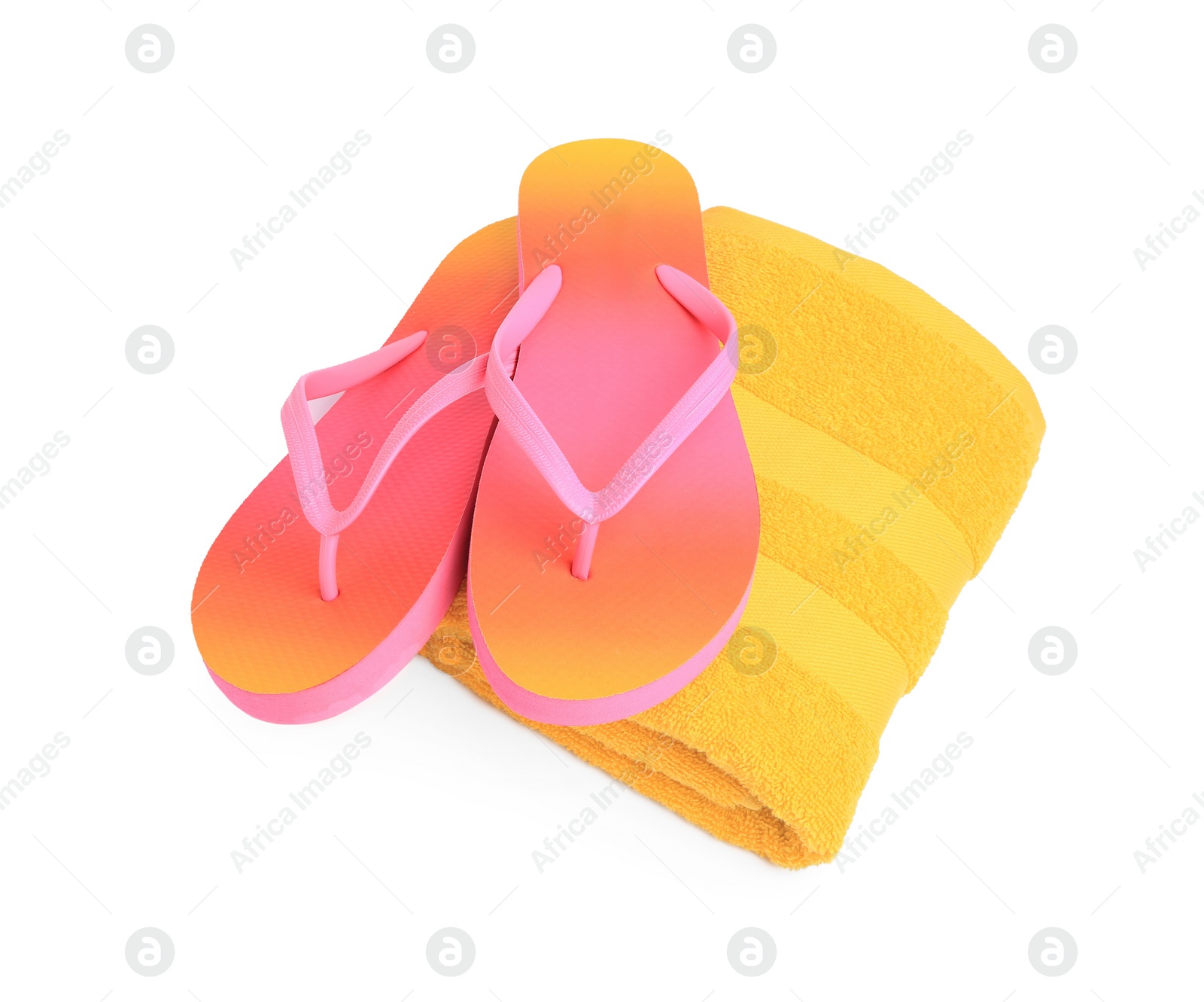 Photo of Yellow terry towel and flip flops isolated on white. Beach objects