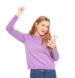 Photo of Happy young woman with smartphone celebrating victory on white background