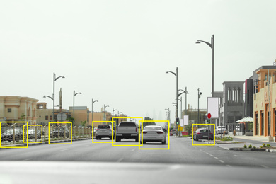 Image of City road with scanner frames on cars outdoors, view from automobile. Machine learning