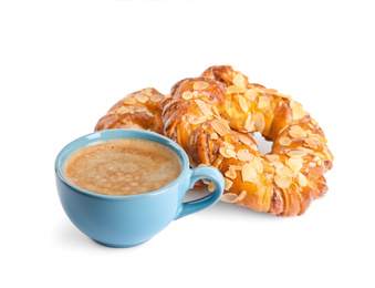 Delicious pastries and coffee on white background