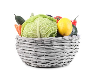 Wicker basket with fresh ripe vegetables and fruit on white background