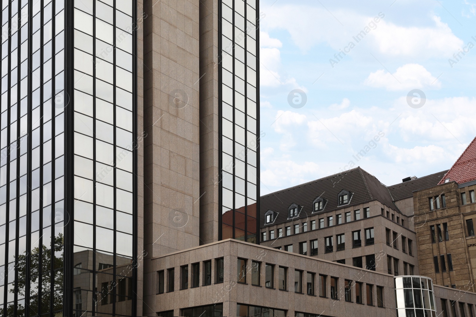 Photo of Beautiful view of modern buildings with big windows in city
