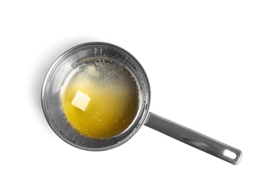 Saucepan with melting butter on white background, top view