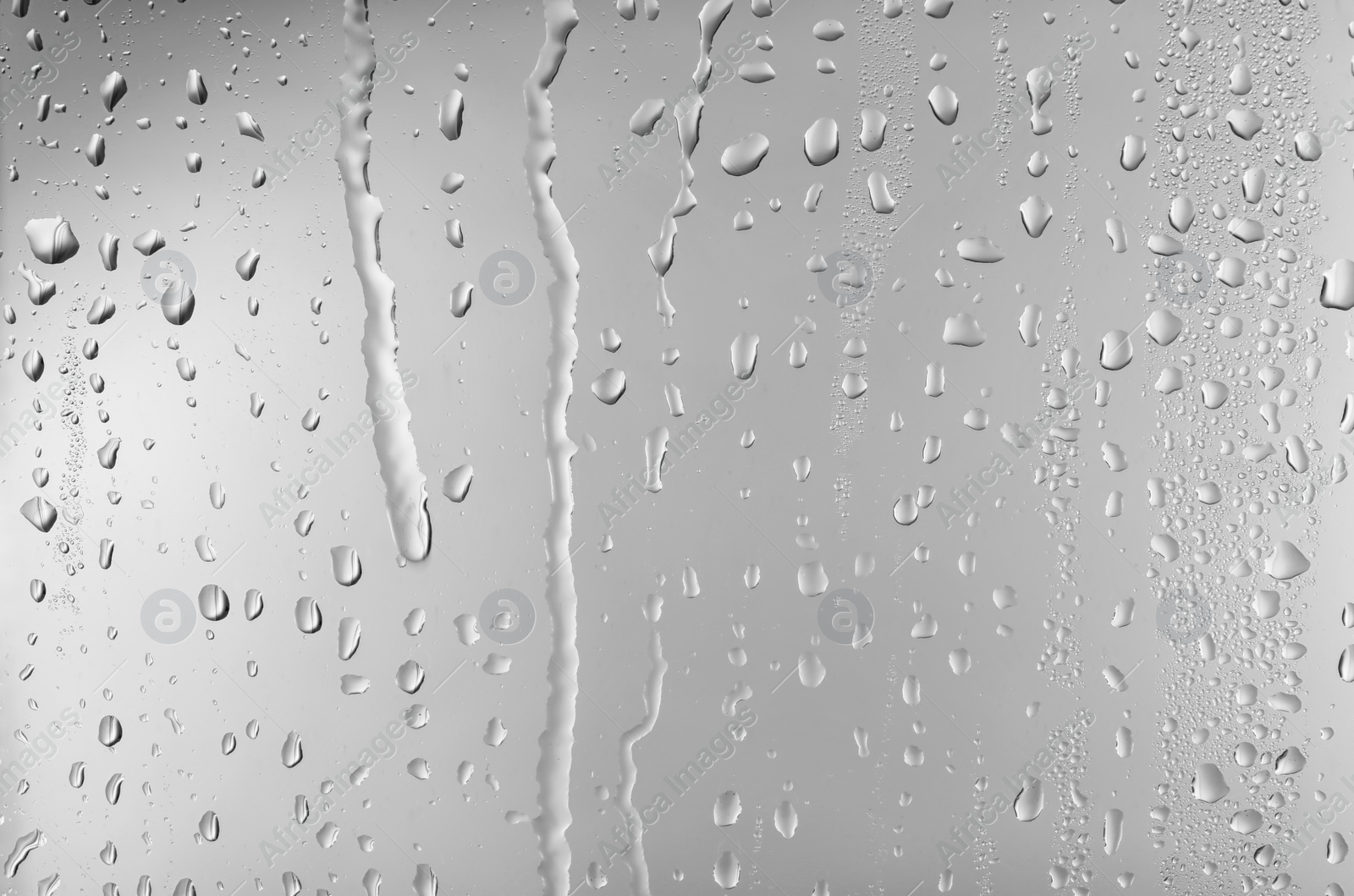 Photo of View of glass with water drops, closeup