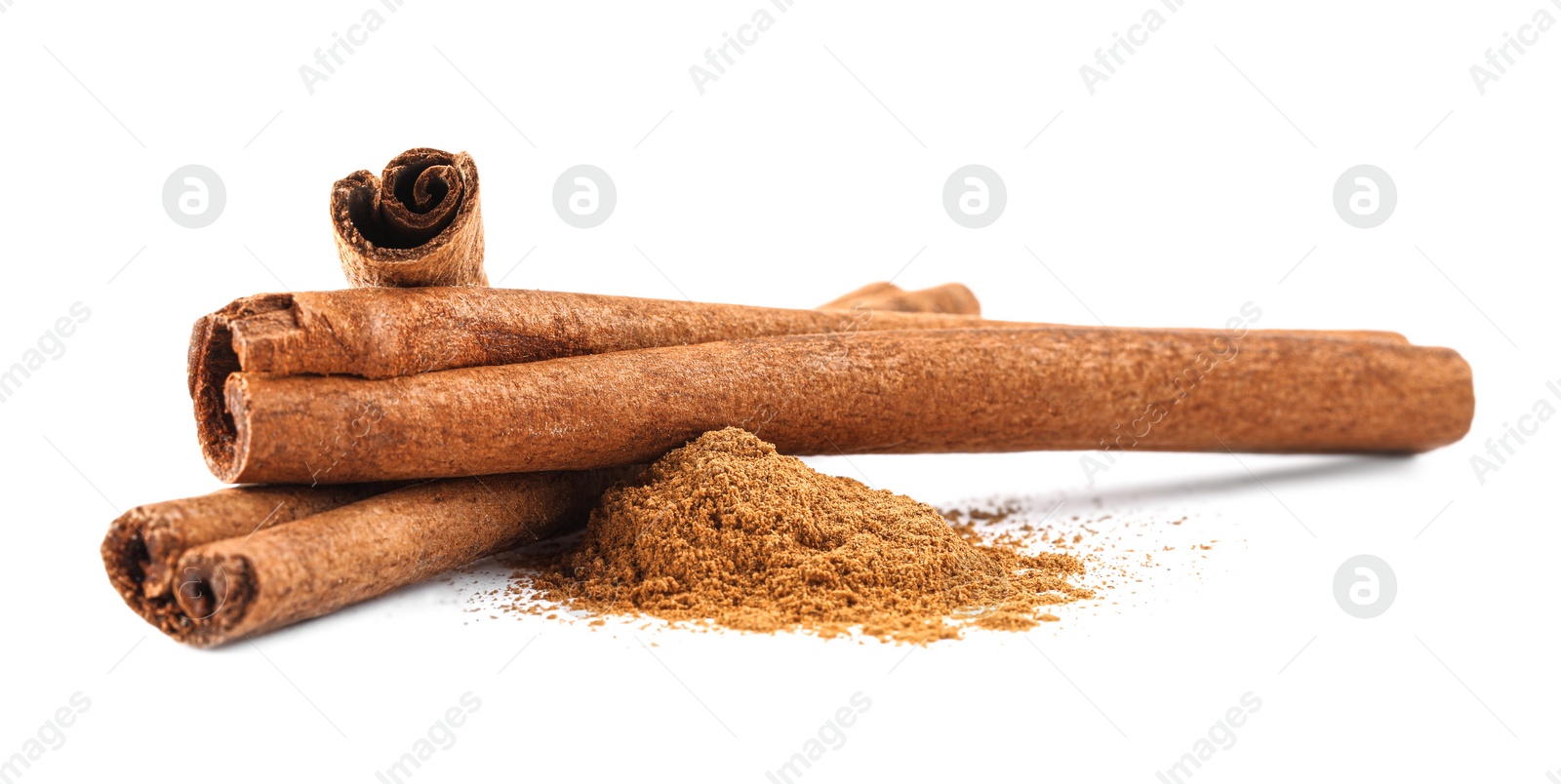 Photo of Dry aromatic cinnamon sticks and powder isolated on white