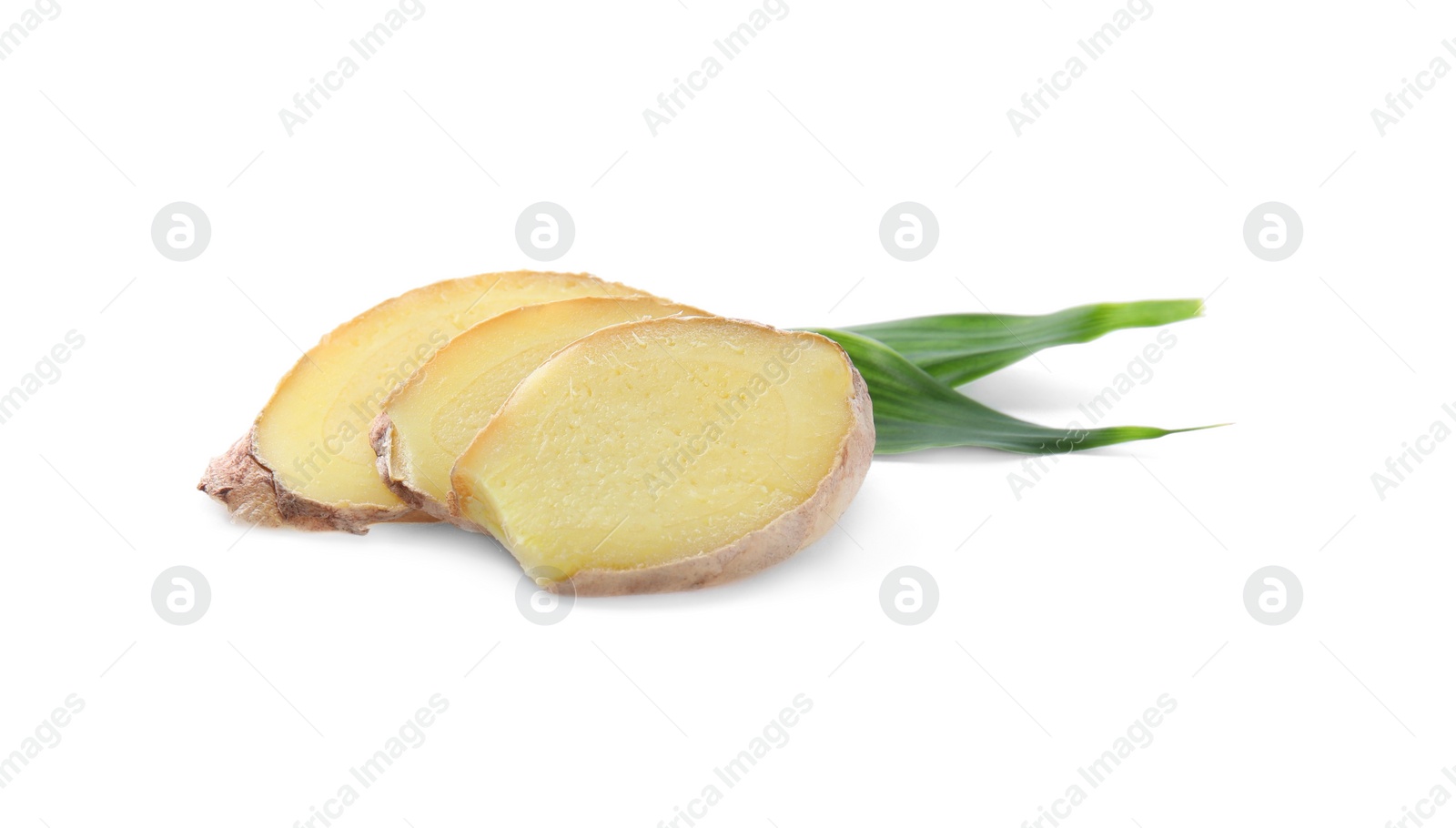 Photo of Slices of fresh ginger and leaves isolated on white