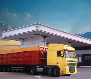Image of Bright truck fueling on modern gas filling station