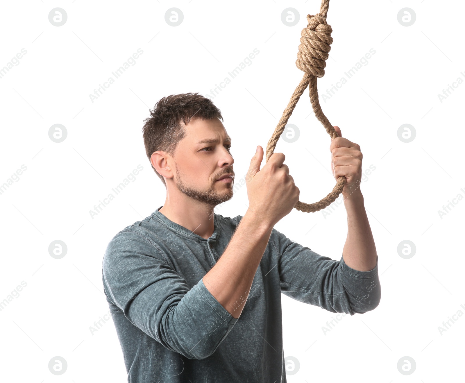 Photo of Depressed man with rope noose on white background