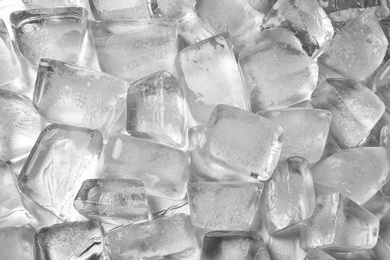Pile of ice cubes on white background