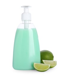 Photo of Dispenser with liquid soap and limes on white background
