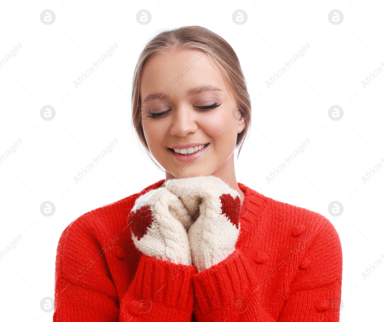 Photo of Young woman in warm sweater and mittens on white background. Winter season
