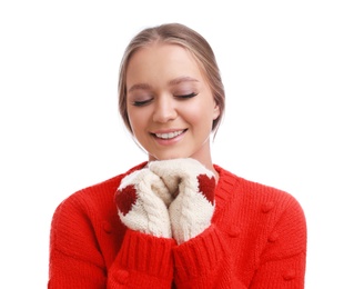 Photo of Young woman in warm sweater and mittens on white background. Winter season