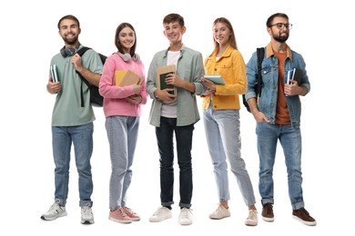 Group of happy students with books on white background
