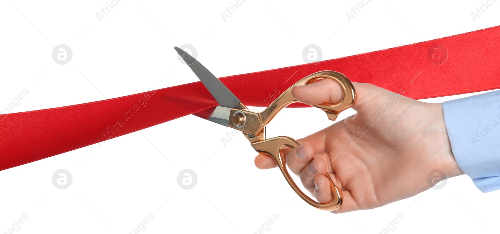 Photo of Man cutting red ribbon on white background, closeup