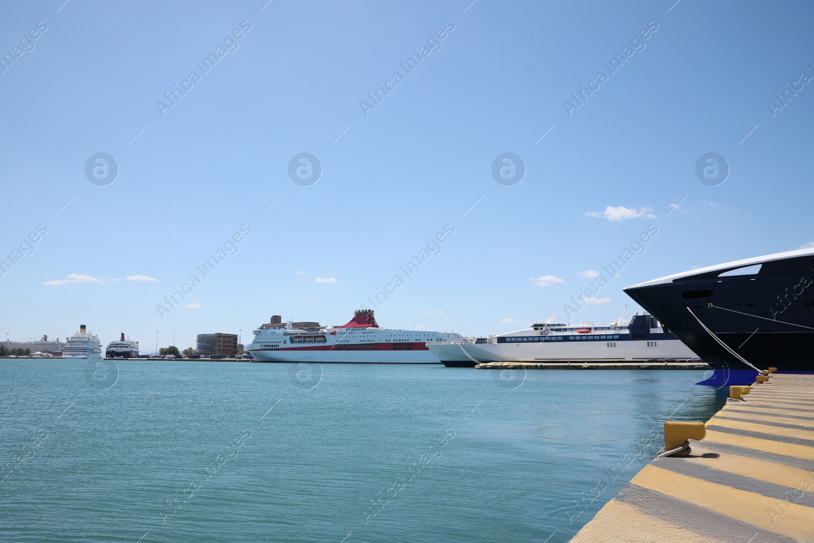 Photo of Picturesque view of port with modern boats on sunny day