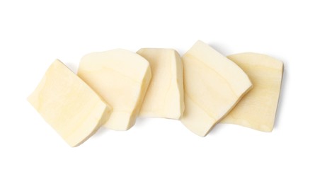 Tasty cut fresh ripe parsnip on white background, top view