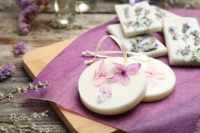 Composition with scented sachets on wooden table