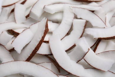Photo of Fresh coconut pieces as background, closeup view