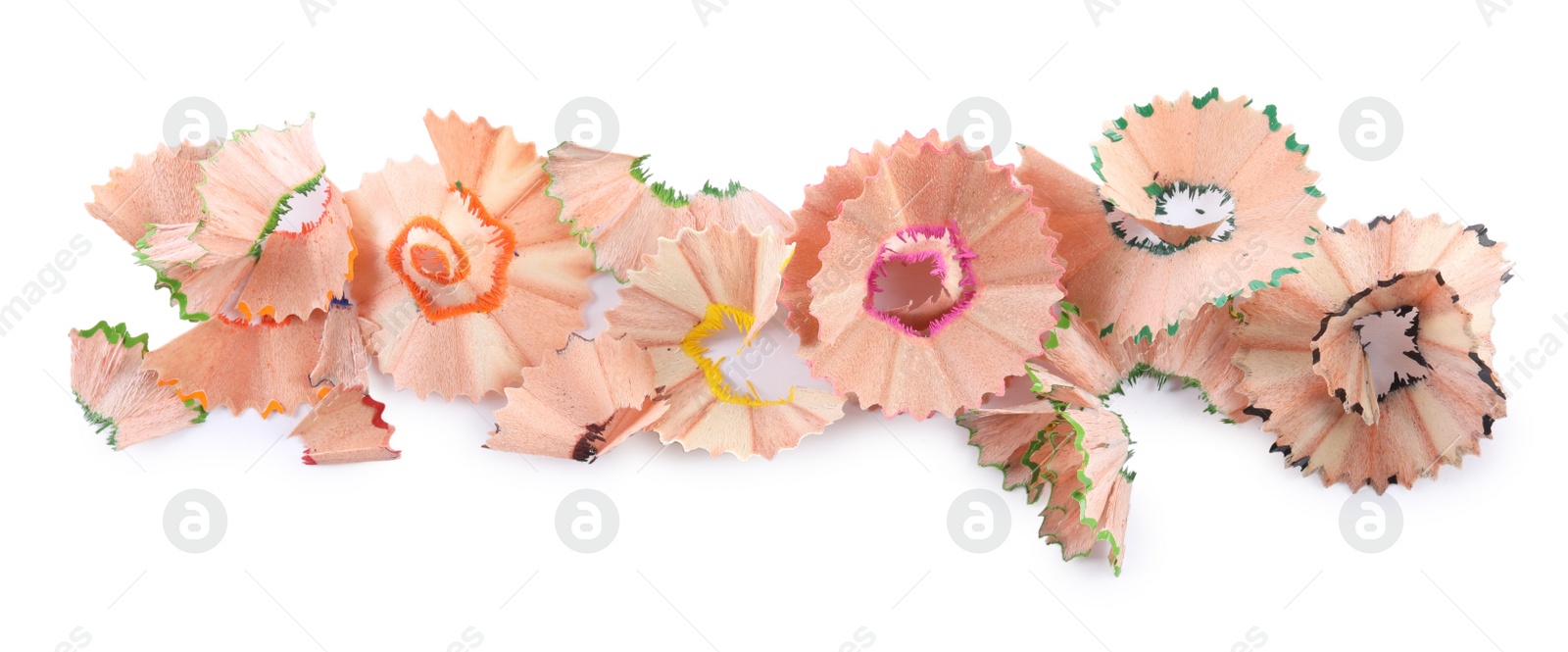 Photo of Colorful wooden pencil shavings on white background, top view