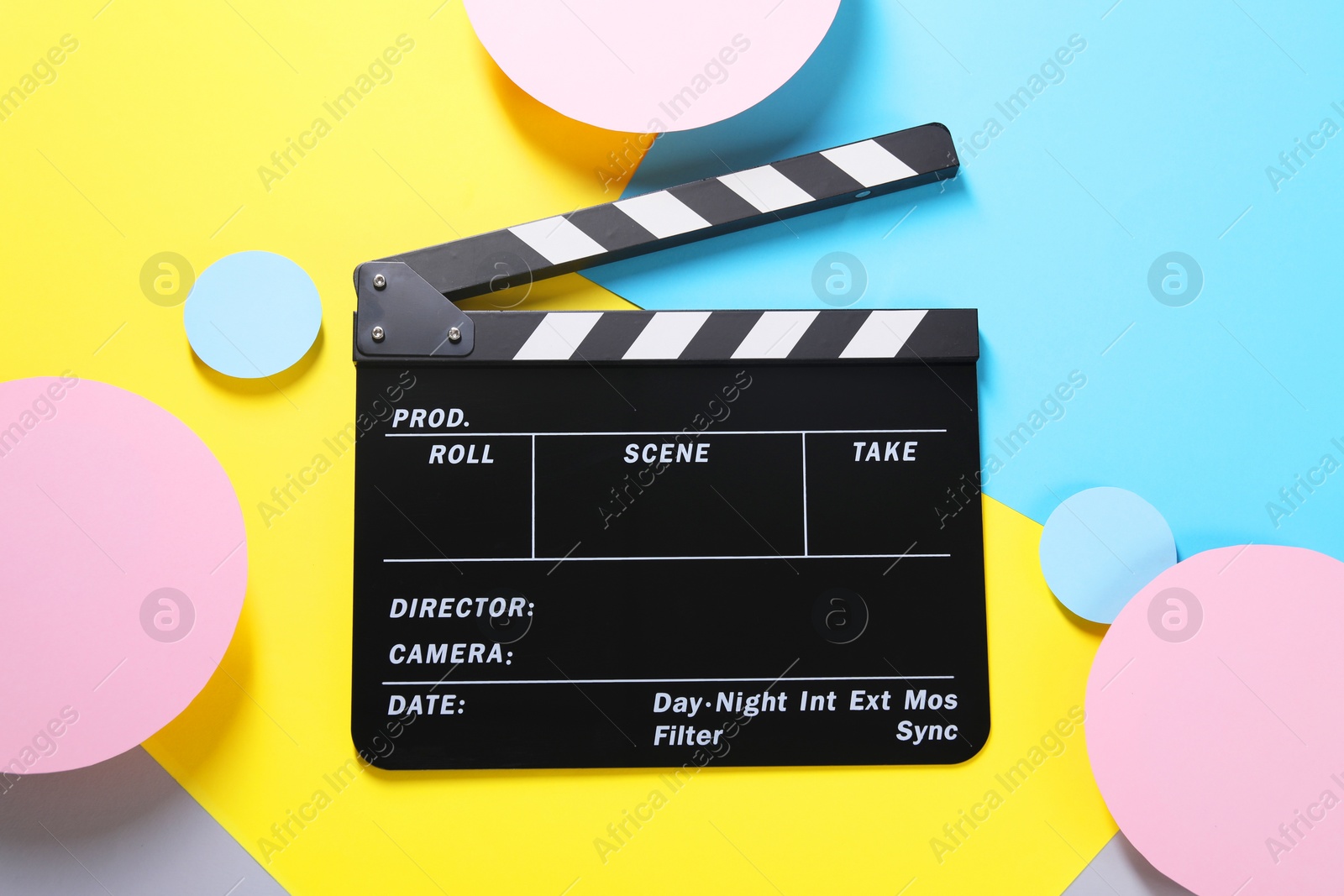 Photo of Clapperboard on color background, top view. Film industry