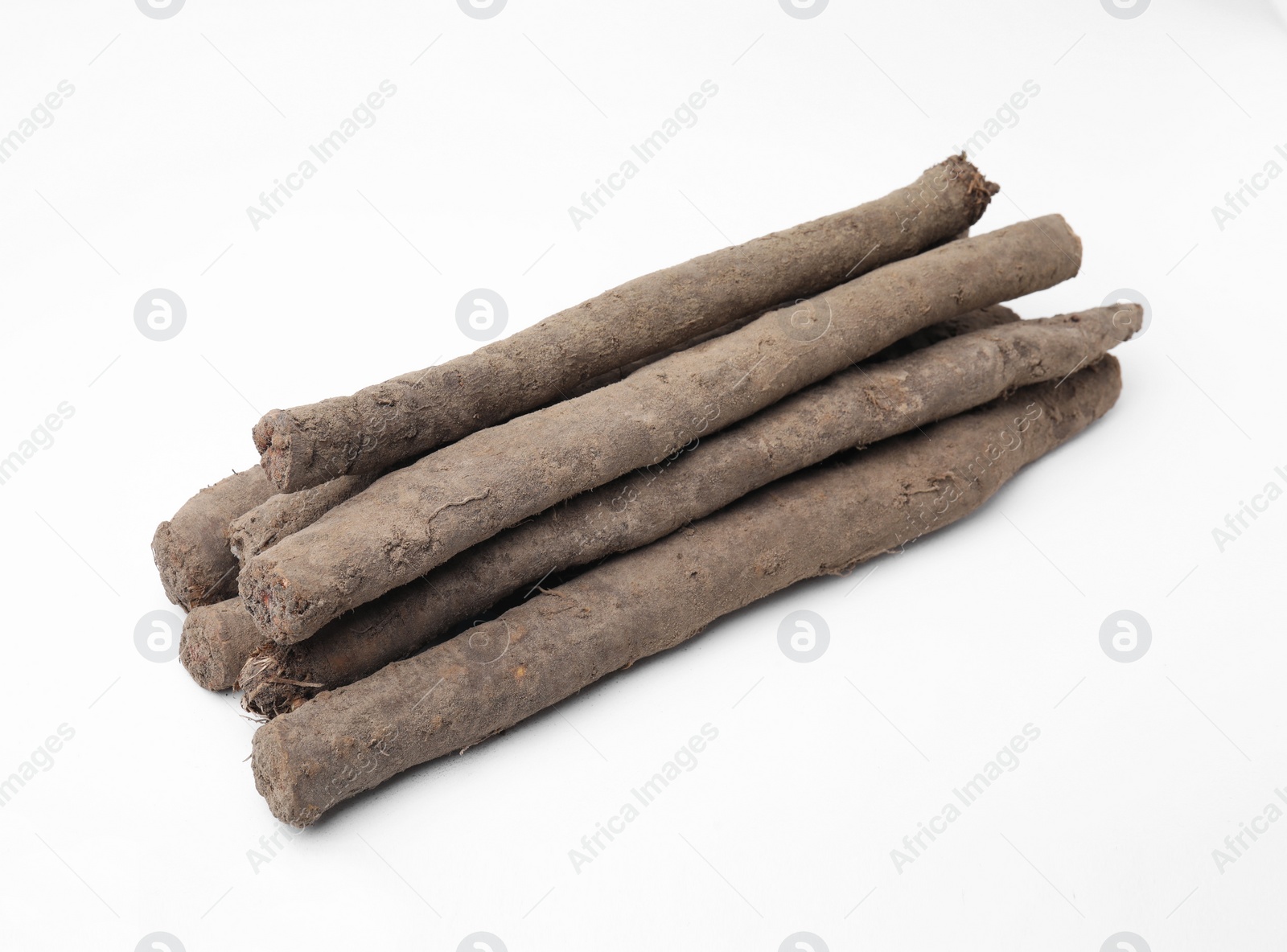 Photo of Fresh raw salsify roots on white background