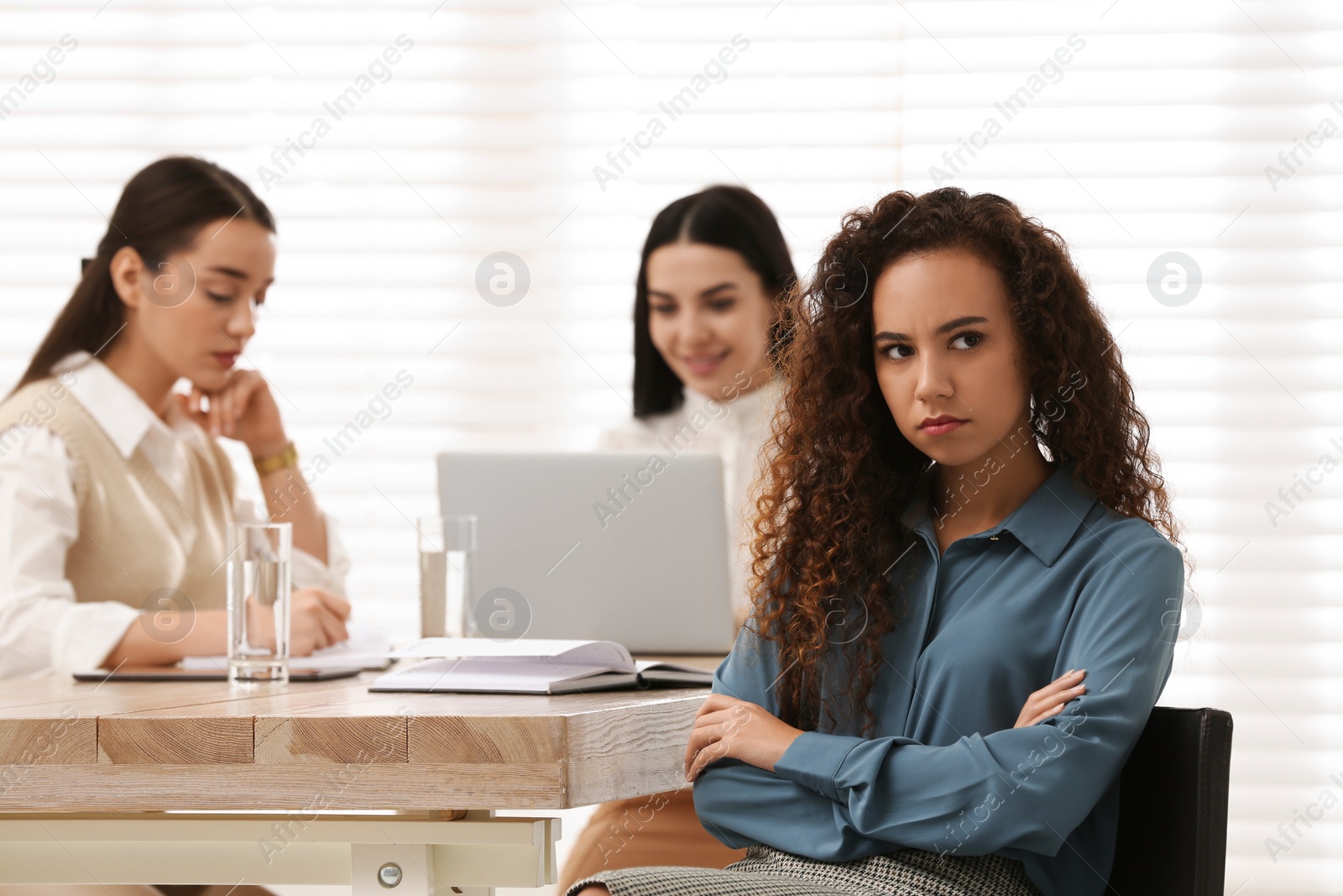 Photo of African American woman suffering from racial discrimination at work