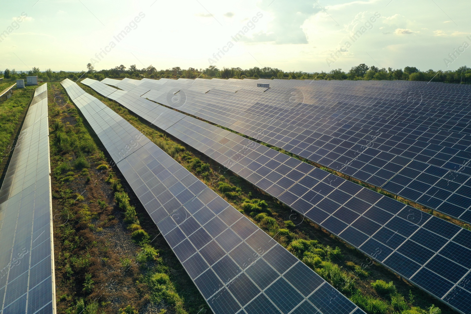 Photo of Solar panels installed outdoors, aerial view. Alternative energy source