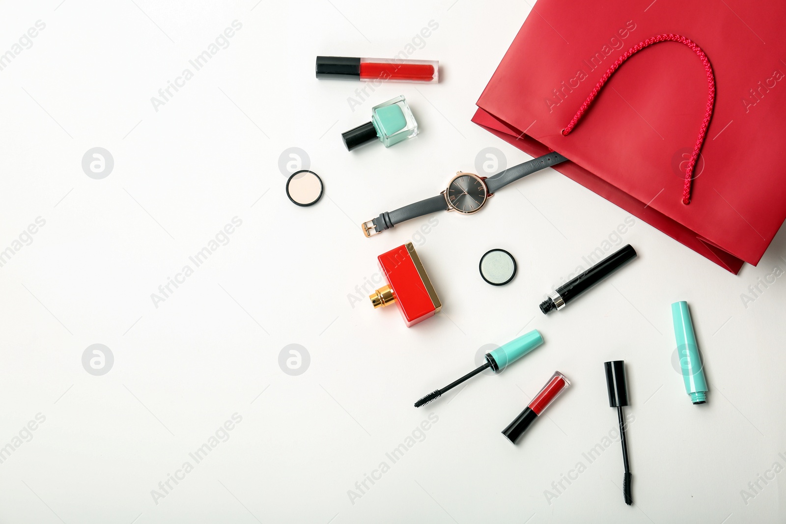 Photo of Flat lay composition with shopping bag and cosmetics on white background