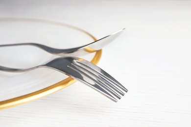 Photo of Elegant table setting on light background, closeup