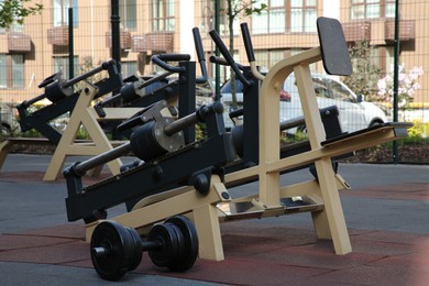 Photo of Empty outdoor gym with exercise simulator in residential area