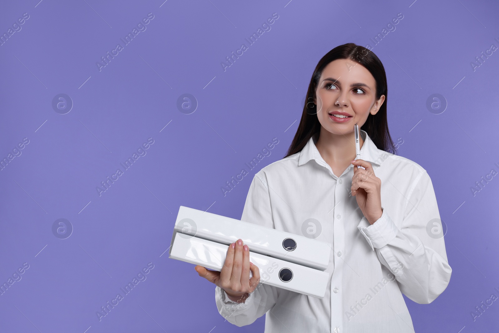 Photo of Thoughtful accountant with folders on purple background, space for text
