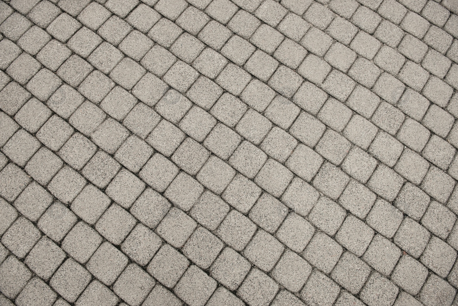 Photo of View on stone sidewal, top view. Footpath covering