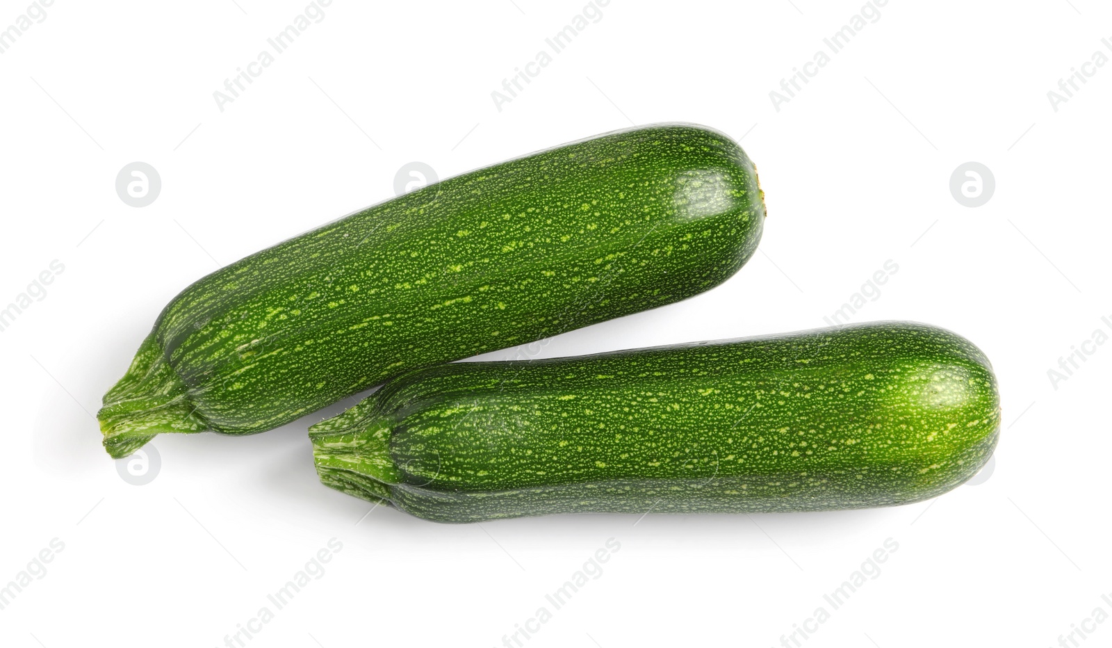 Photo of Raw ripe zucchinis on white background, top view