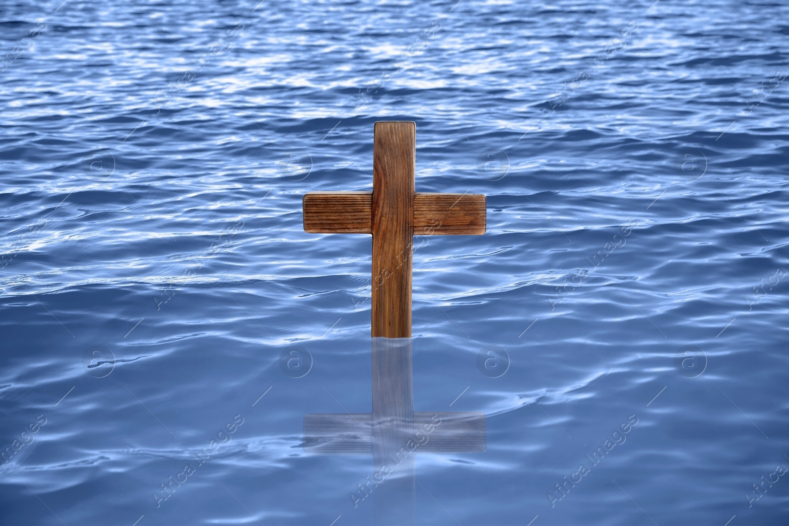 Image of Wooden cross in river for religious ritual known as baptism