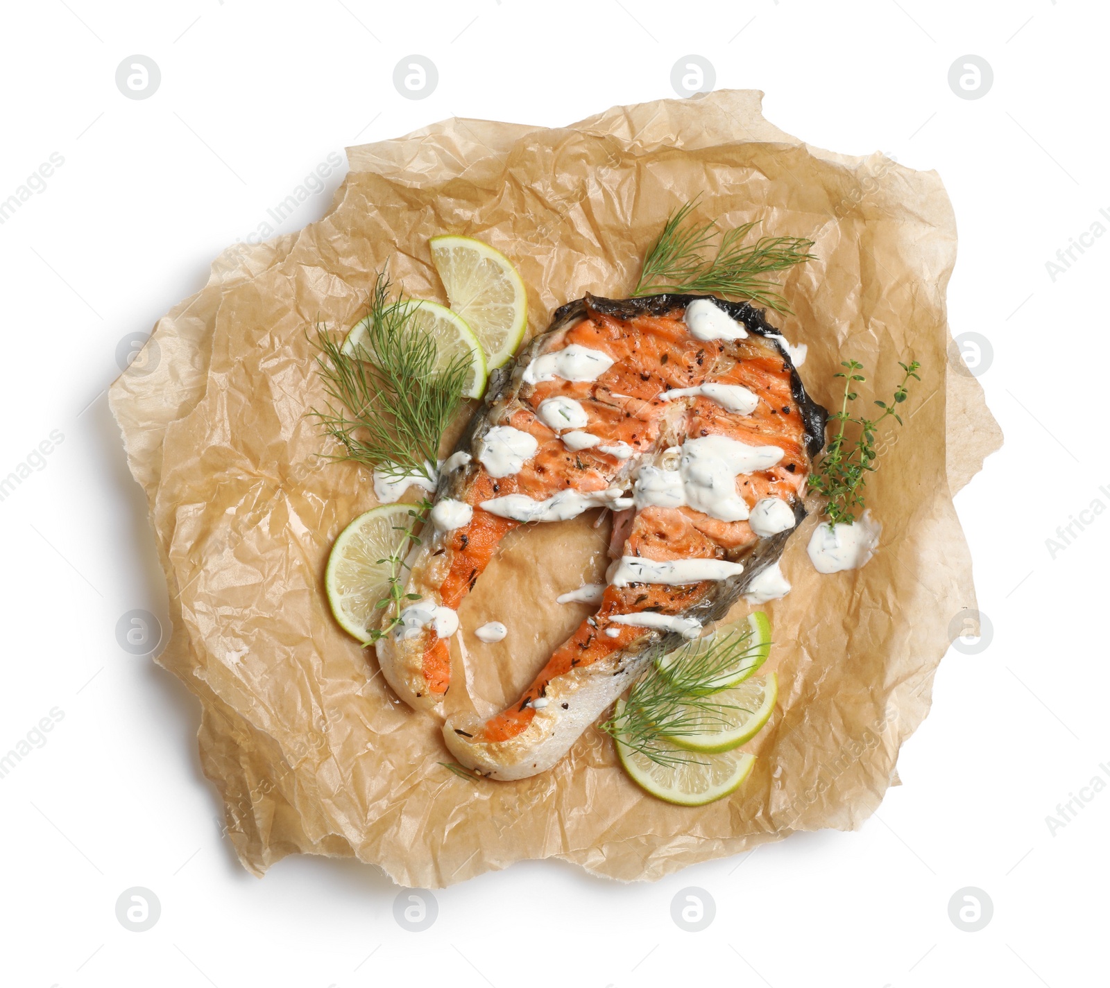 Photo of Tasty salmon steak with sauce, citrus slices and herbs on white background, top view