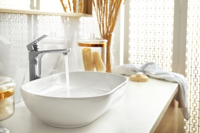 Stylish white sink in modern bathroom interior