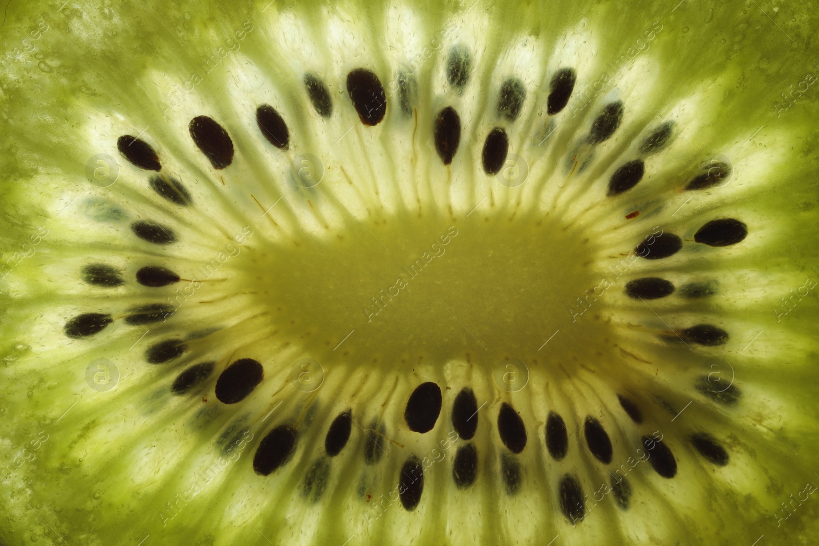 Photo of Tasty kiwi with seeds as background, macro